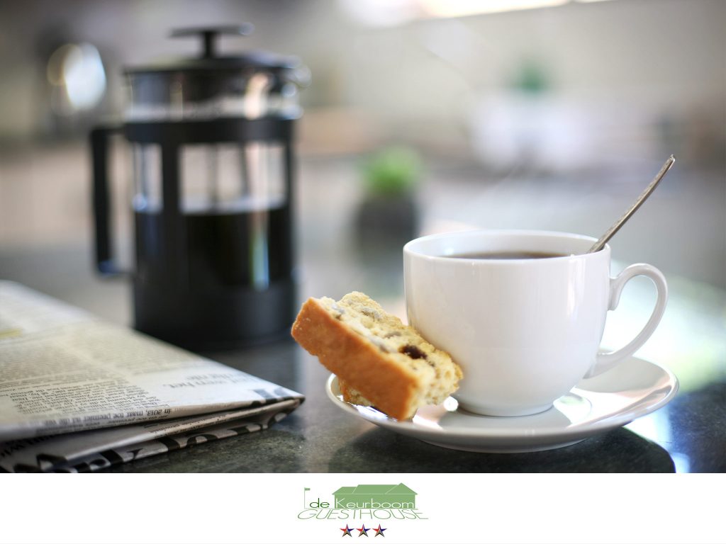 Freshly brewed coffee and a rusk at De Keurboom Guesthouse